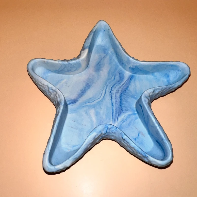 A blue Sculpted starfish with multiple decorative functions