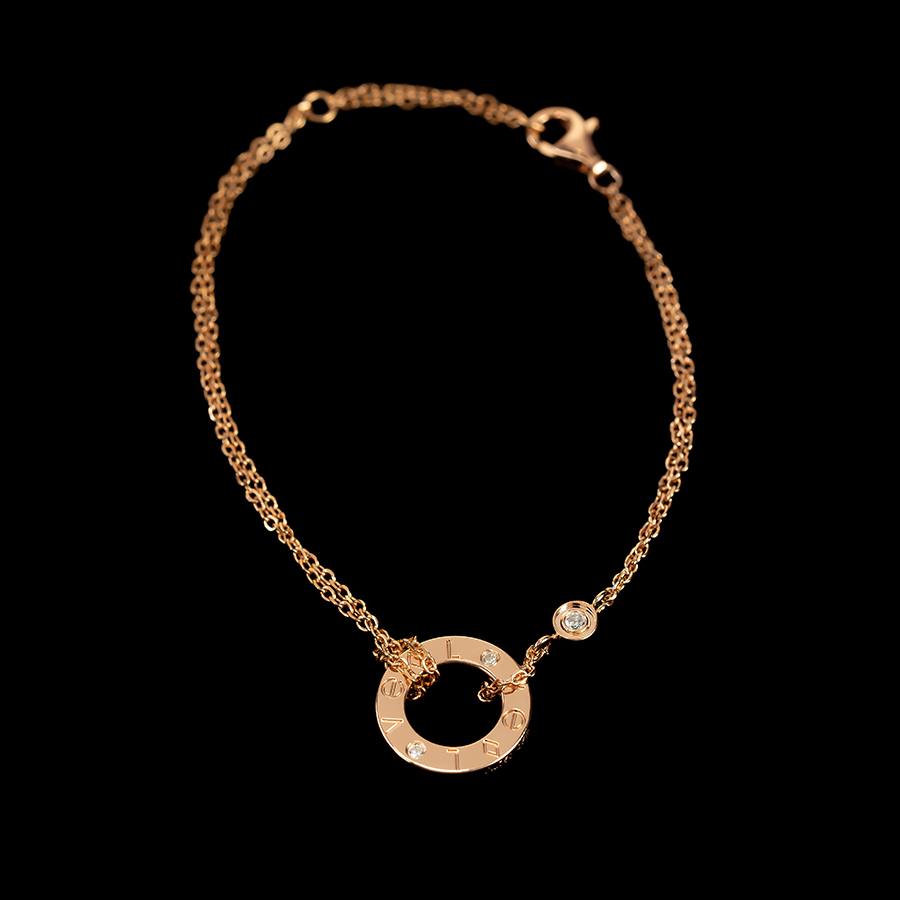 Women's fine bracelet features a delicate loop design, plated in 18K gold