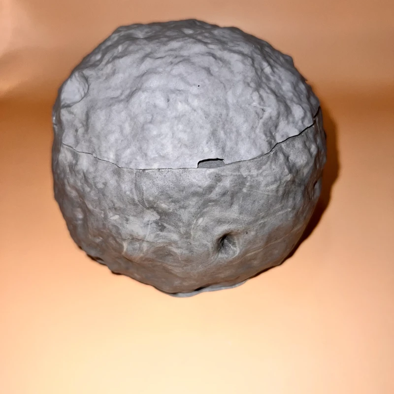 A Grey Jesmonite Sculpted Moon with multiple decorative functions