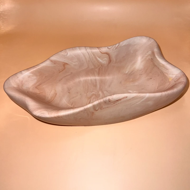 A wavy bowl Jesmonite warm brown marble design with multiple decorative functions